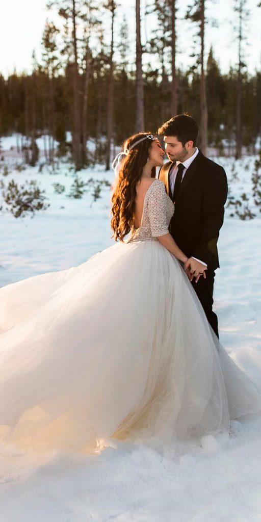 ball gown layered skirt ivory lace sleeves low back what to wear to a winter wedding radionphotography