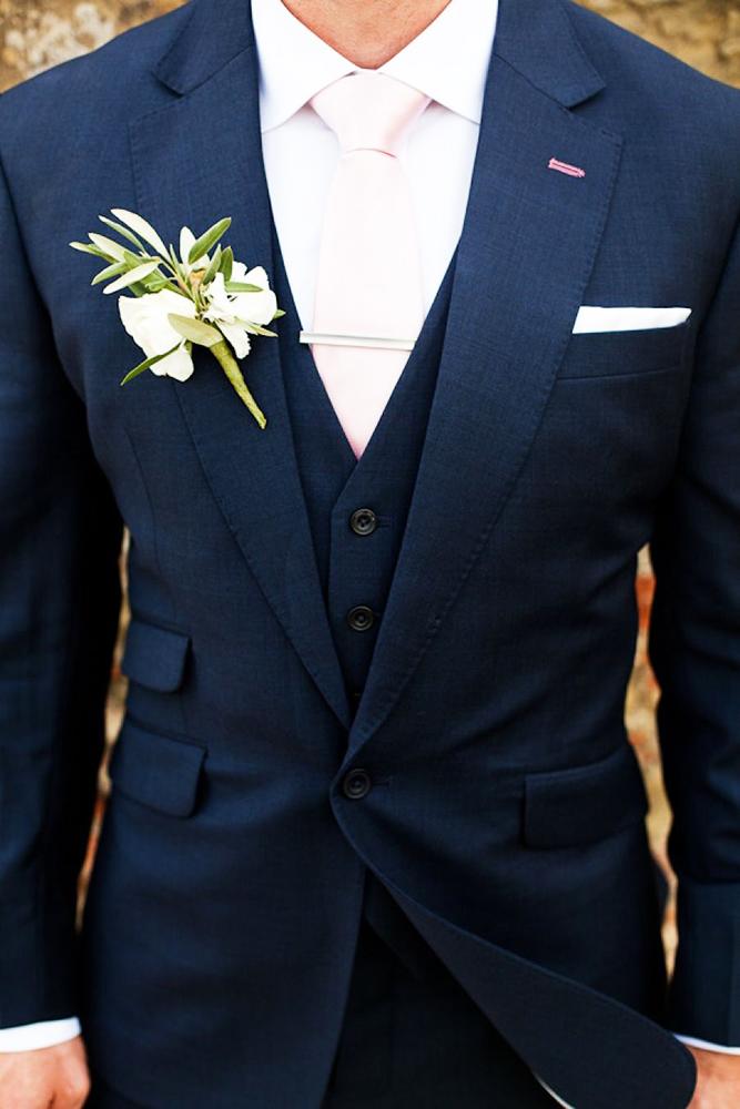 groomsmen attire navy with tie and boutonniere m and j photography