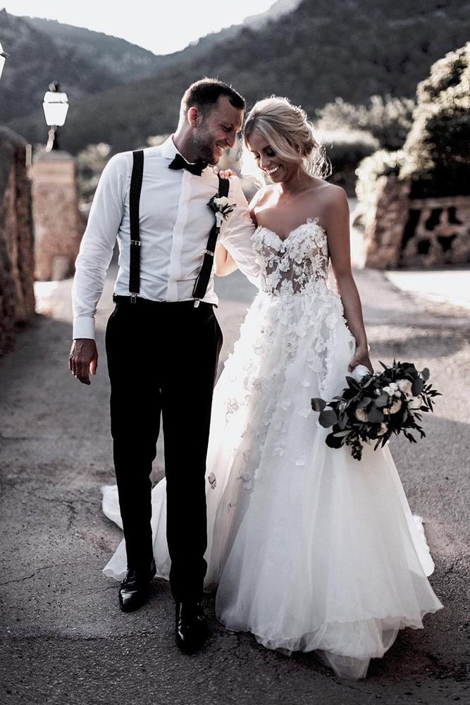 groomsmen attire with suspenders bow tie and boutonniere tali