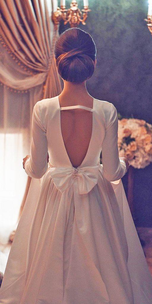 romantic bridal gowns v back with long sleeves with bow axarmina photography